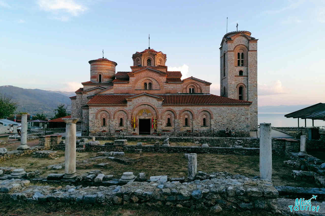 view of a church with archeological findings in front of it